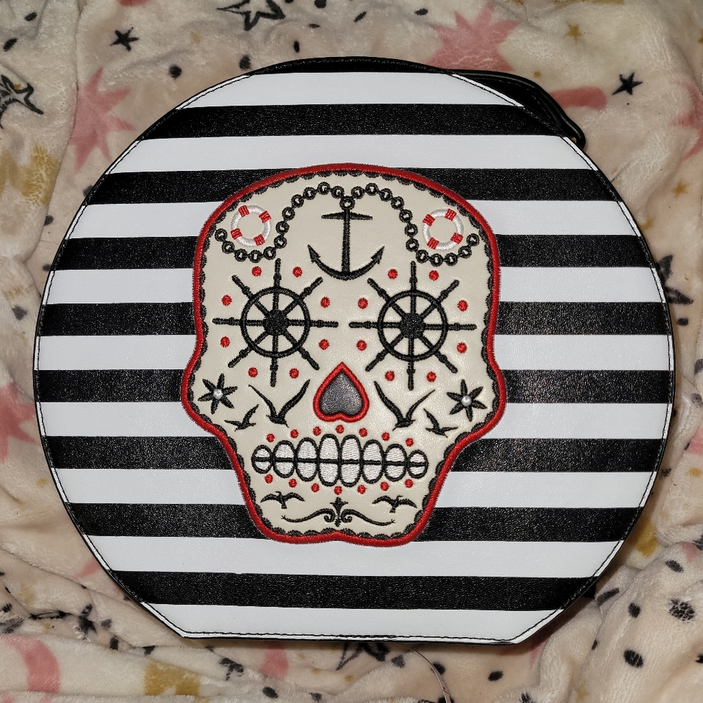 Banned circular stripped sugar skull purse